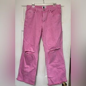 Pink distressed denim jeans